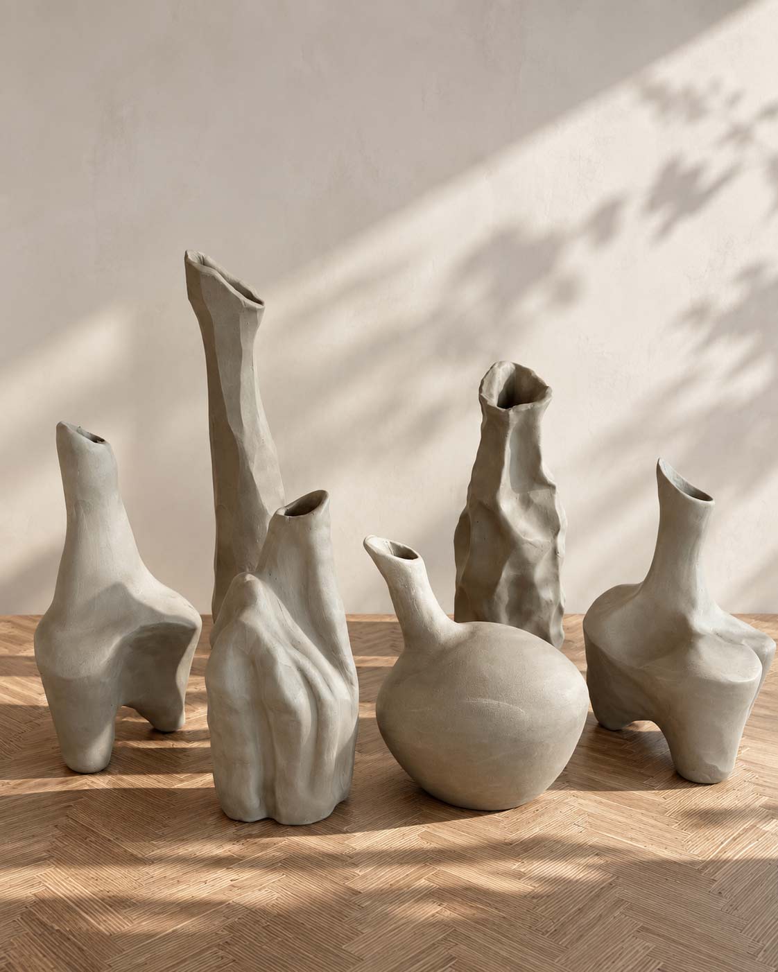 Sculptural unglazed porcelain vessels by Maria Baleva in afternoon light